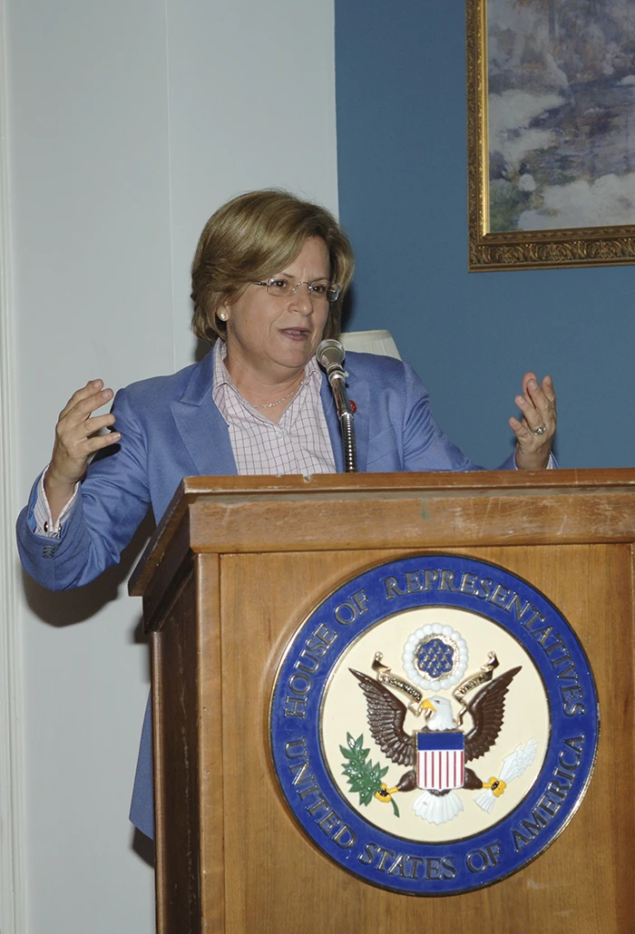 Ileana Ros-Lehtinen standing in front of her portrait at the Florida Congress