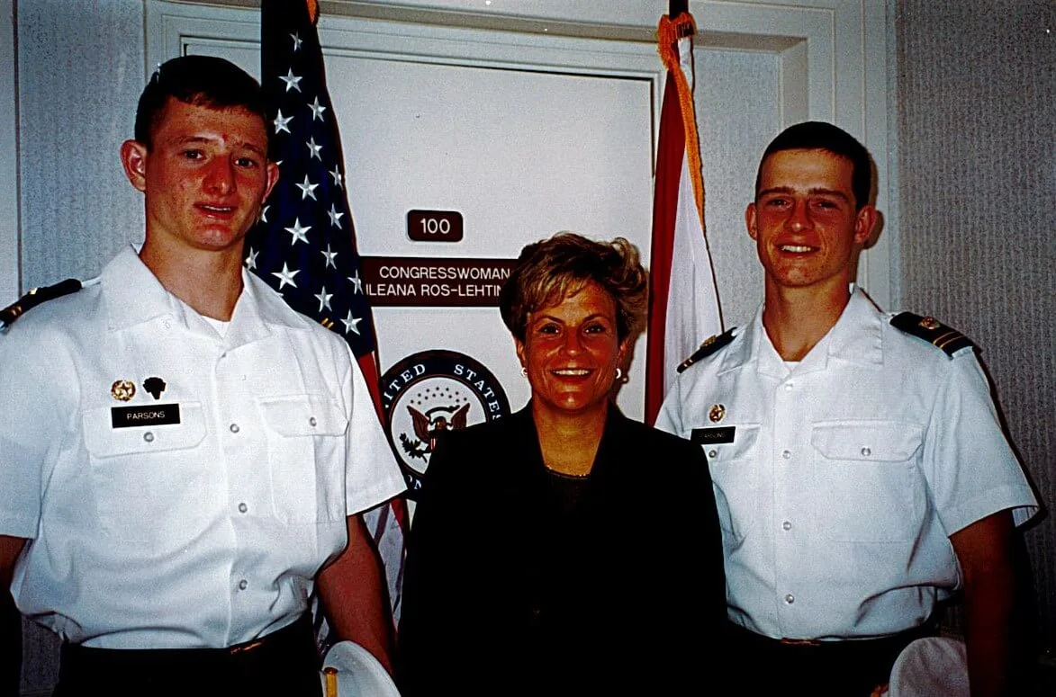 Ileana Ros-Lehtinen standing with Naval officers